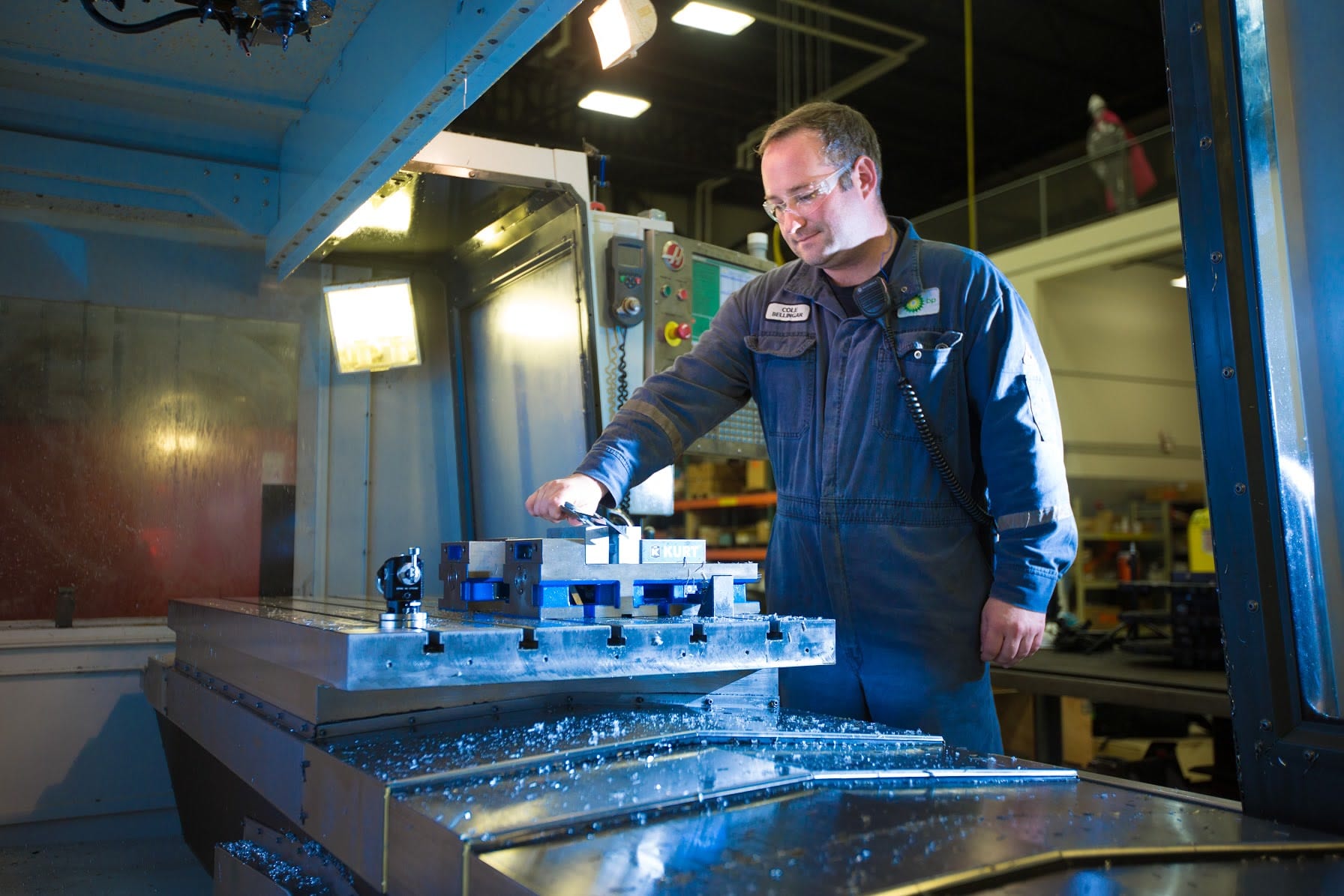 Machinist operating CNC mill